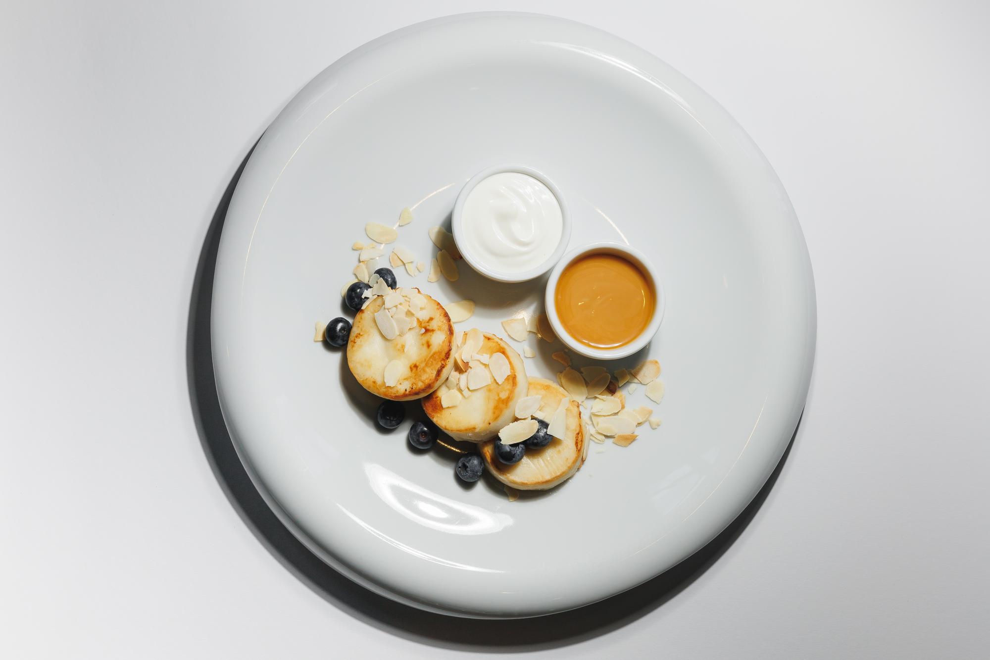 Large editorial shot of plated menu trio