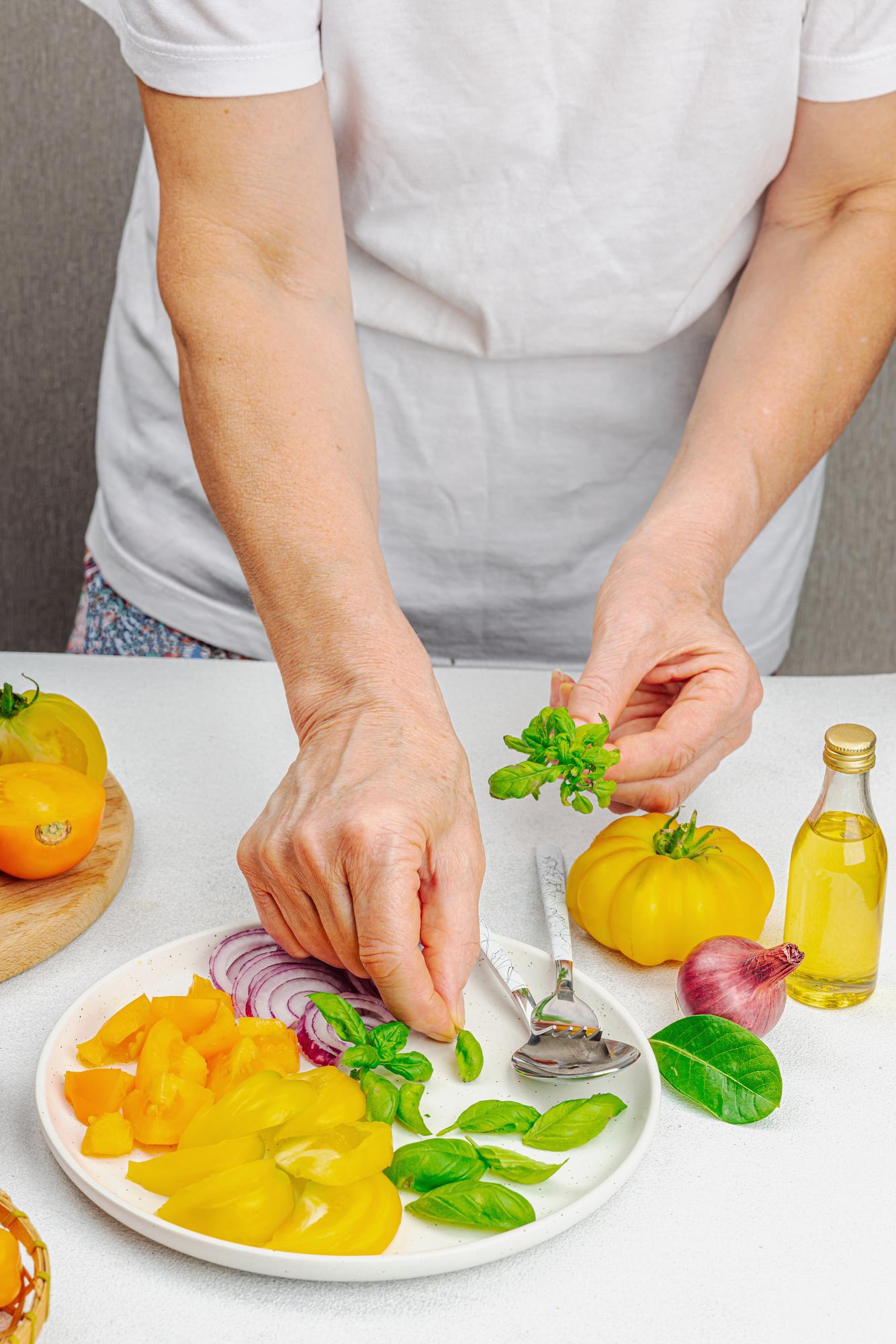 Chef hands arranging garnishes